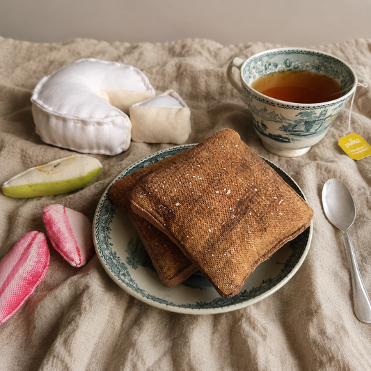 Handmade textile French toast play food served on a plate with tea and fabric food accessories