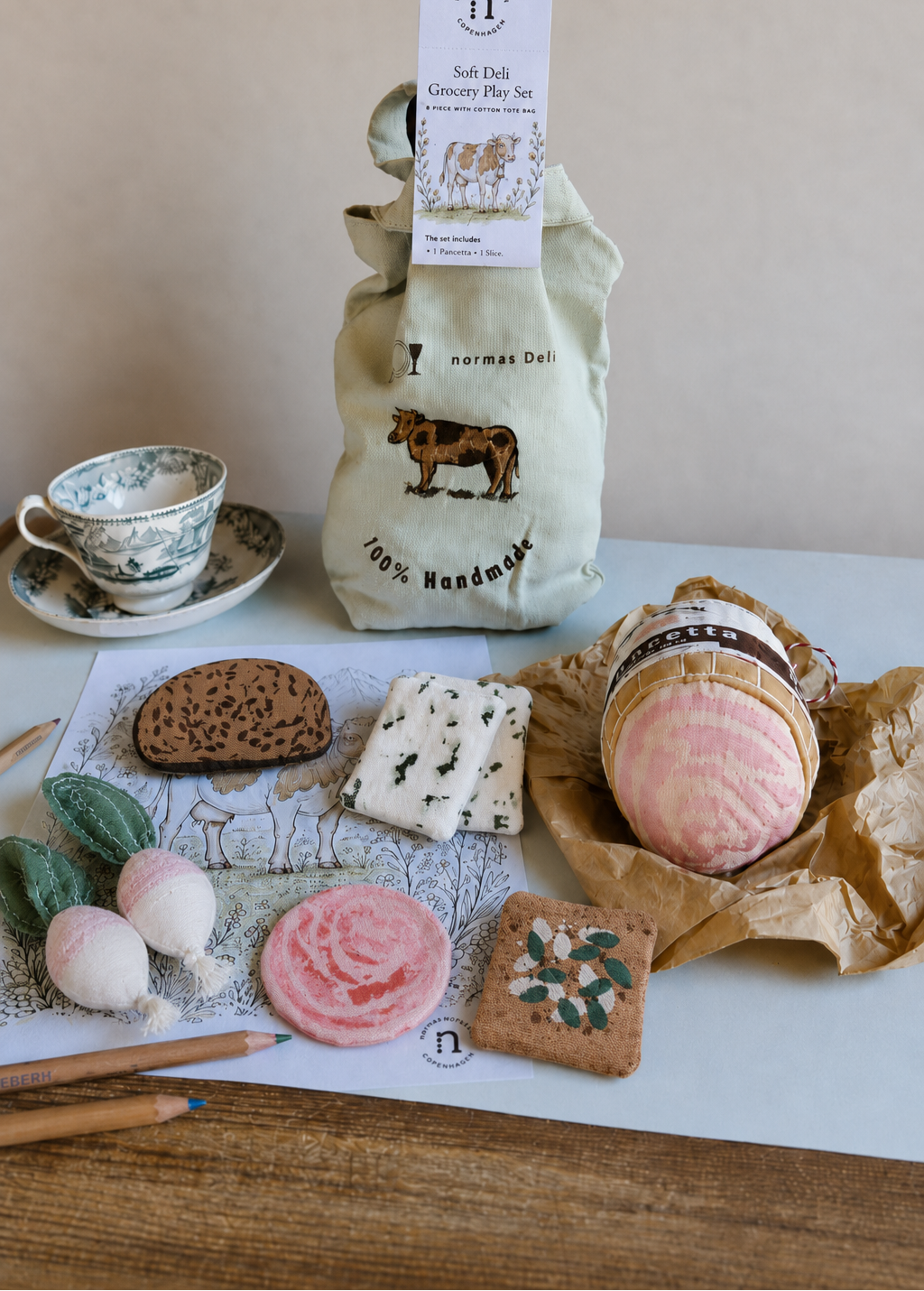 Handmade soft deli grocery play set with embroidered cotton tote bag, fabric pancetta, cow colouring sheet, coloured pencils and vintage teacup.