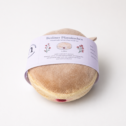 Handmade Berliner Pfannkuchen velvet play food toy with raspberry jam detail and illustrated paper band