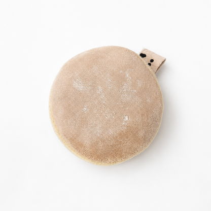 Top view of a handmade Berliner Pfannkuchen velvet play food toy with powdered sugar details and fabric label