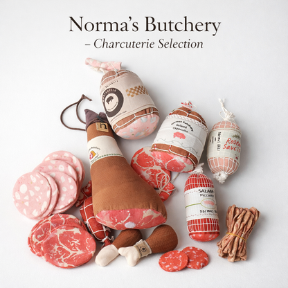 Assorted fabric charcuterie products with 'Norma's Butchery' branding on a light background