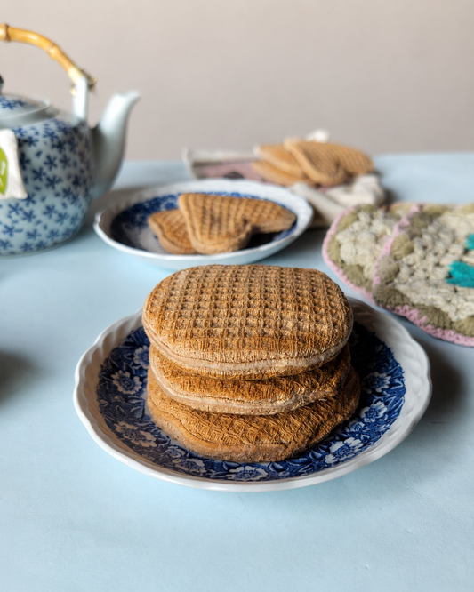 Handmade Dutch stroopwafel play food on a vintage blue floral plate