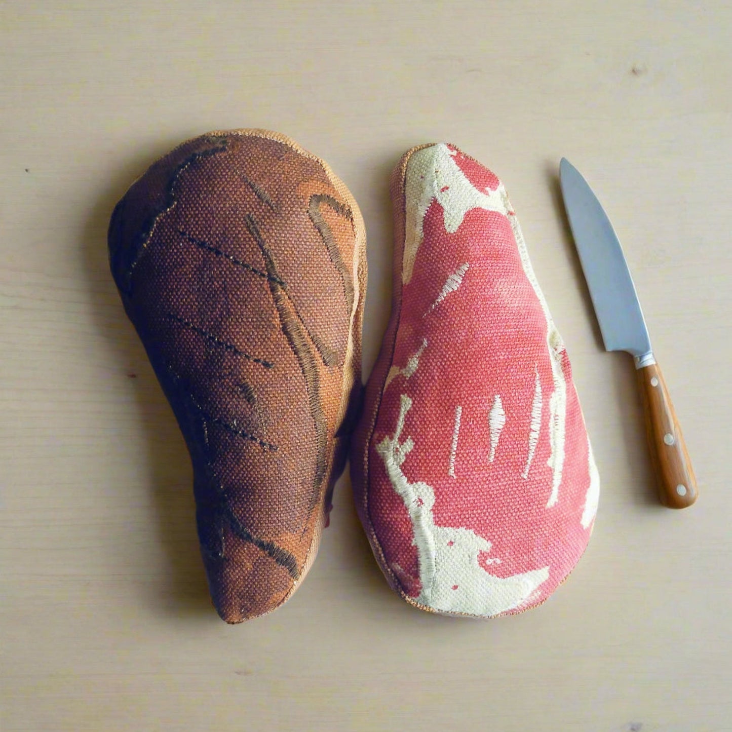 Dual-sided ribeye steak pretend-food toy—raw and grilled versions side-by-side with wooden-handle knife for play kitchens
